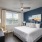 Bedroom with Large Windows and Ceiling Fan